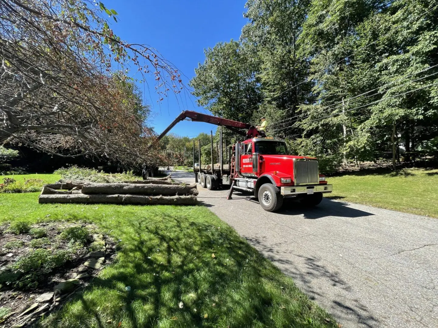 A red truck is parked on the side of a road.